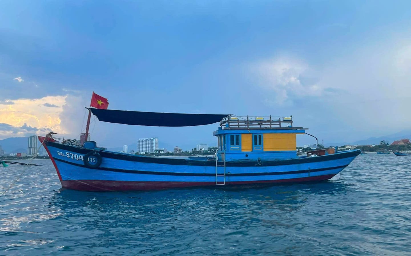 Traditional blue wooden fishing boat used for Phu Quoc fishing tours